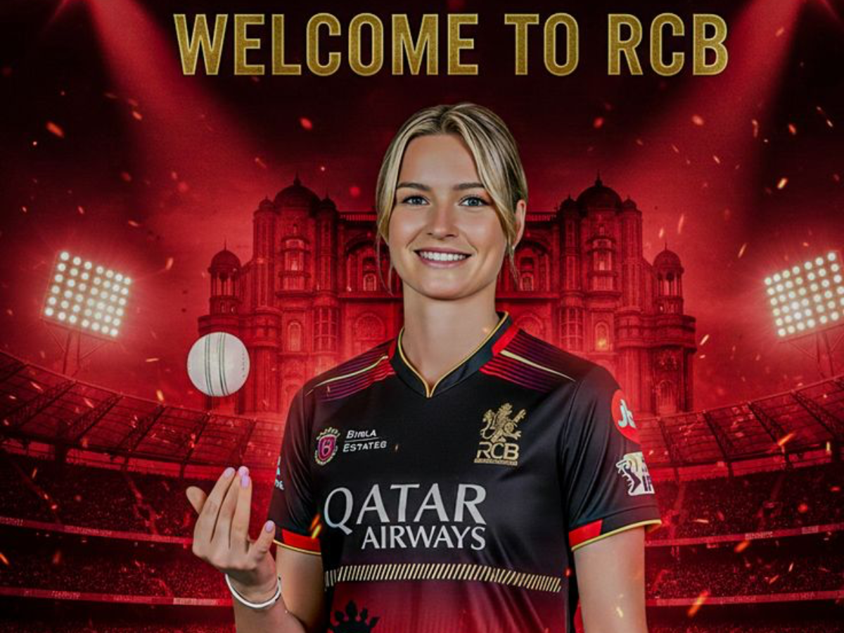 Lauren Bell after the WPL auction with RCB branding - Photo Gallery